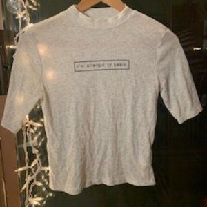 Grey stretchy ribbed top with mock neck.